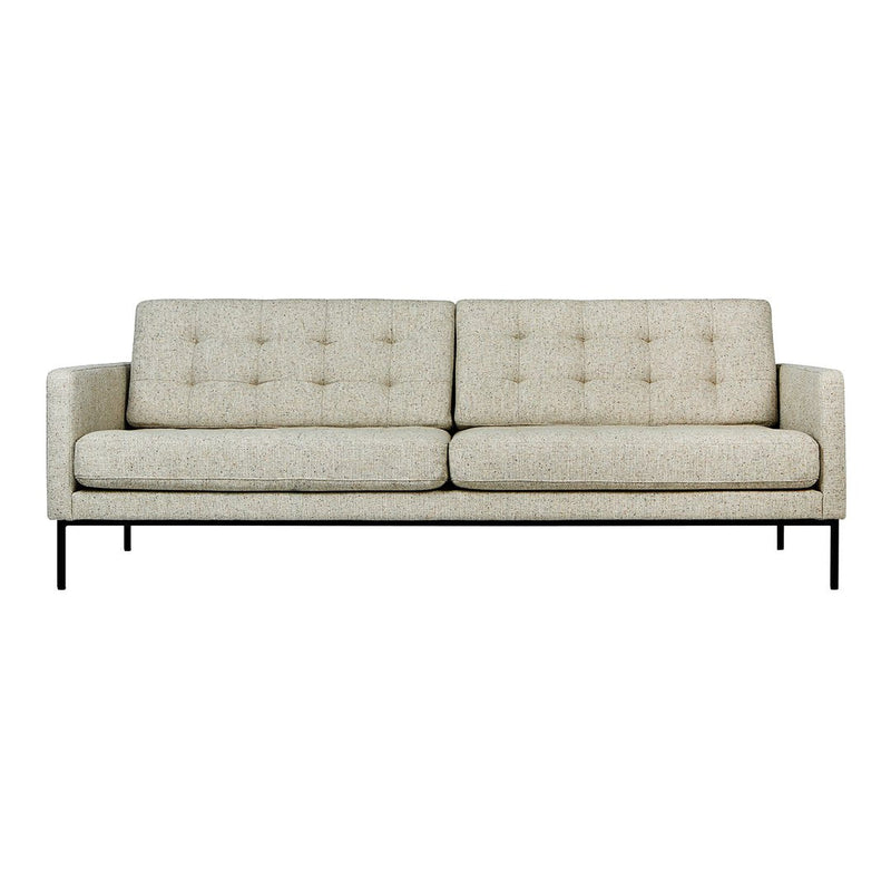 Light beige sofa with subtle tufted pattern and sleek black metal legs, perfect for modern decor.