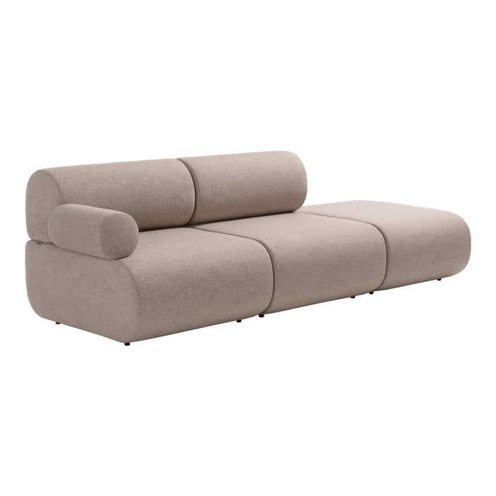 Contemporary beige sofa with smooth curves and a minimalist design, featuring soft, textured fabric upholstery.