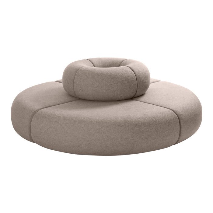 Round beige cushion with smooth texture and subtle seams, featuring a raised circular accent in the center.