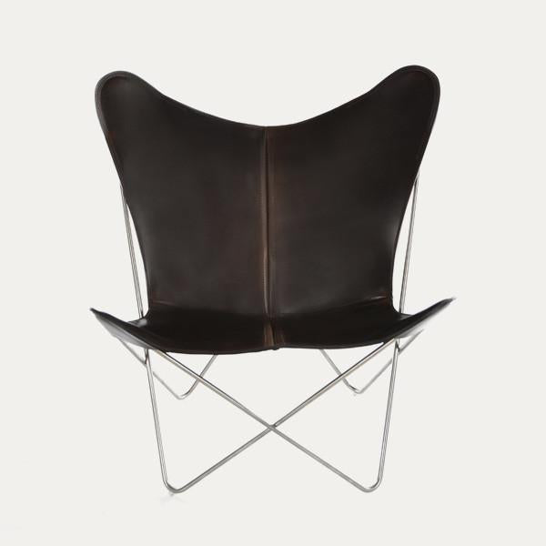 Brown leather butterfly chair with a minimalist design and sleek silver frame. Perfect for modern decor.
