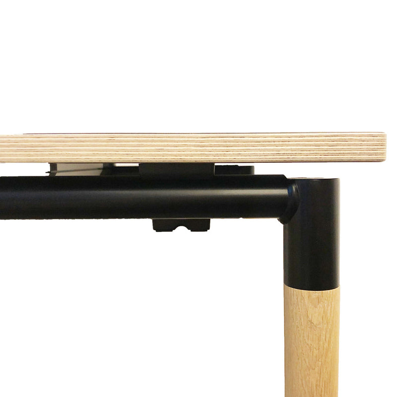 Light wood tabletop with a smooth grain pattern, paired with a sleek black metal frame and natural wood legs.