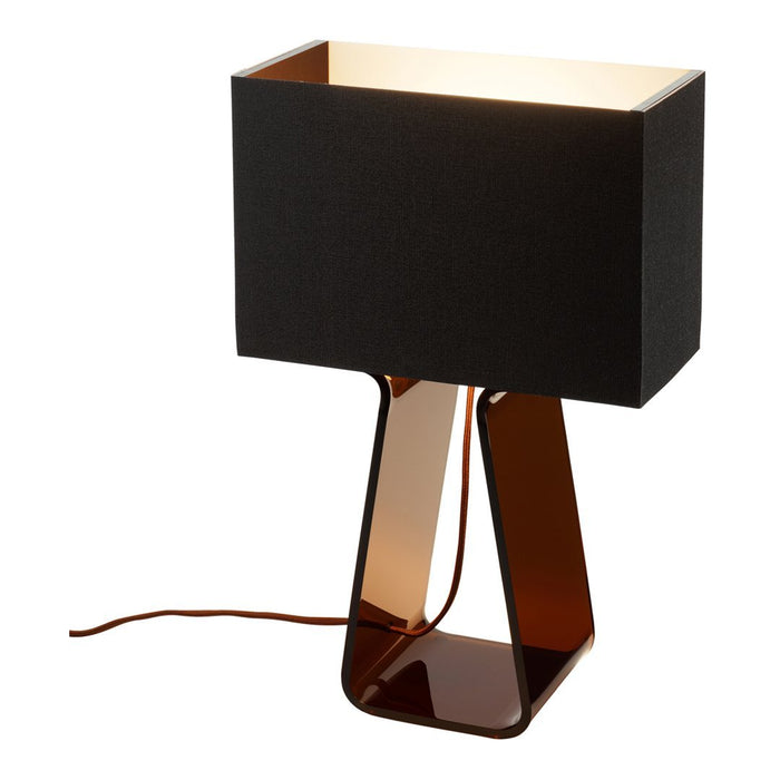 Modern black and amber table lamp with a sleek geometric design. Ideal for stylish home decor.