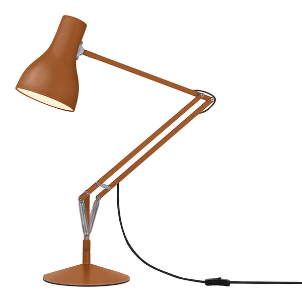 "Bronze desk lamp with sleek lines and a modern design, featuring a warm brown shade and chrome accents."