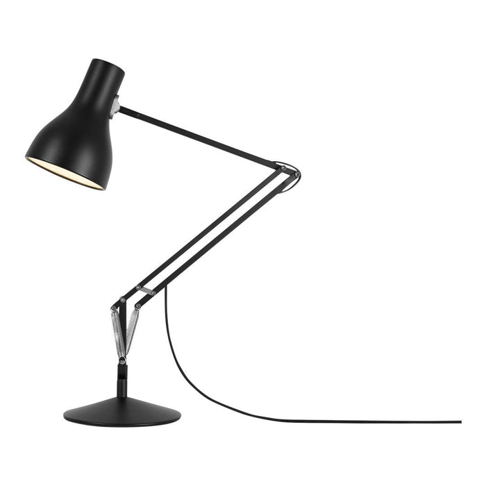 Black desk lamp with sleek, modern design and chrome accents, featuring a matte finish and a minimalist aesthetic.