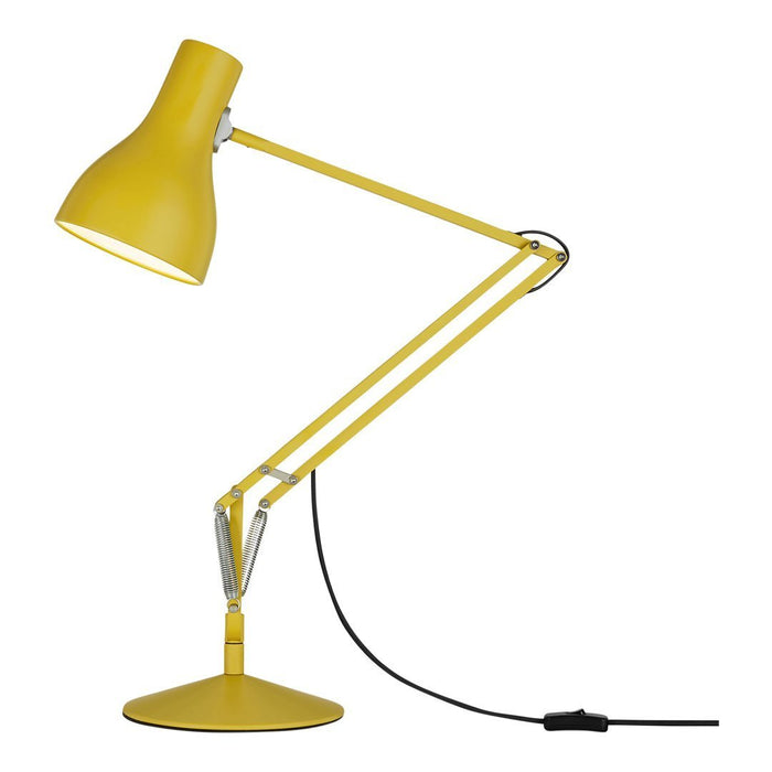 Bright yellow desk lamp with a sleek, modern design and a glossy finish, featuring an adjustable angled arm.