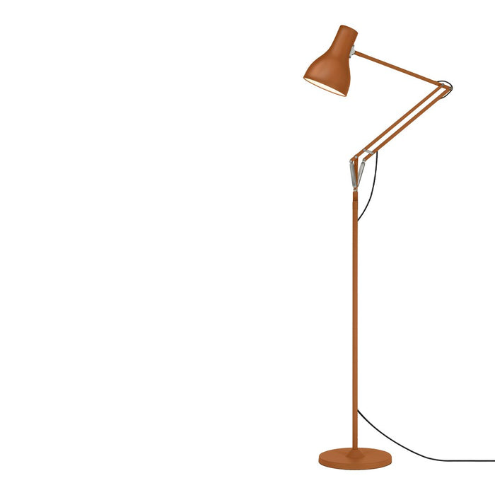 Rust-orange adjustable floor lamp with a sleek, minimalist design and matte finish. Perfect for modern interiors.