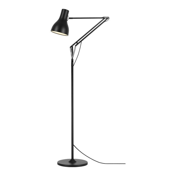 Black metal floor lamp with sleek, minimalist design and a matte finish, featuring a geometric shade and base.