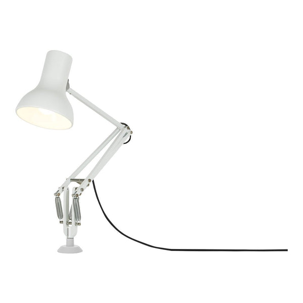 White industrial desk lamp with a sleek arm and black cord, featuring a minimalist design. Perfect for modern decor.