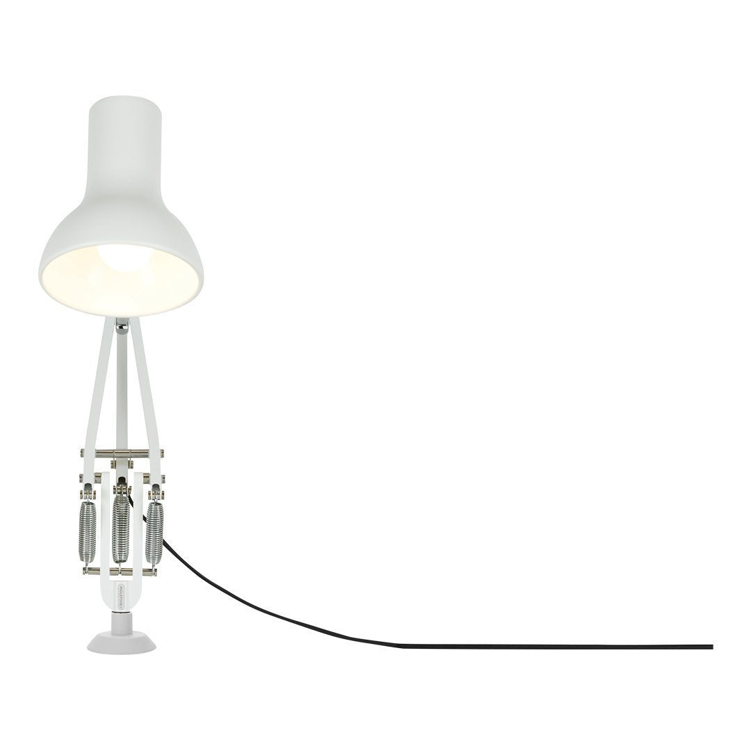 Modern white lamp with sleek design, featuring a cylindrical shade and a contrasting black cord.