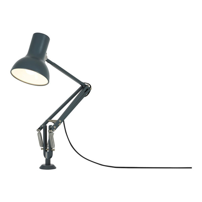 Adjustable black desk lamp with a matte finish and sleek, modern design, featuring a white interior shade.