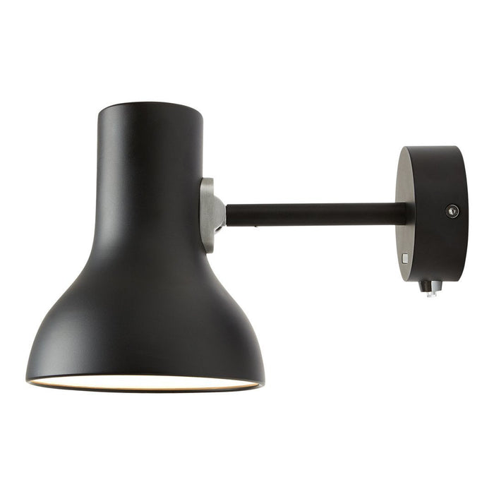 Black wall-mounted lamp with a sleek, matte finish and a minimalist design. Circular backplate and straight arm.