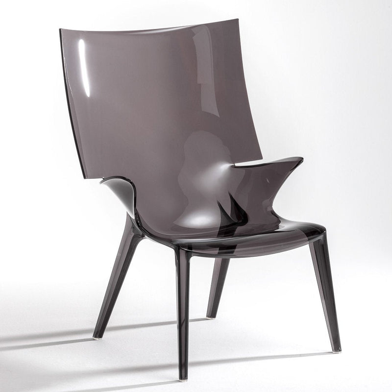 Sleek grey acrylic chair with a glossy finish and modern, minimalist design. Contemporary accent for any space.