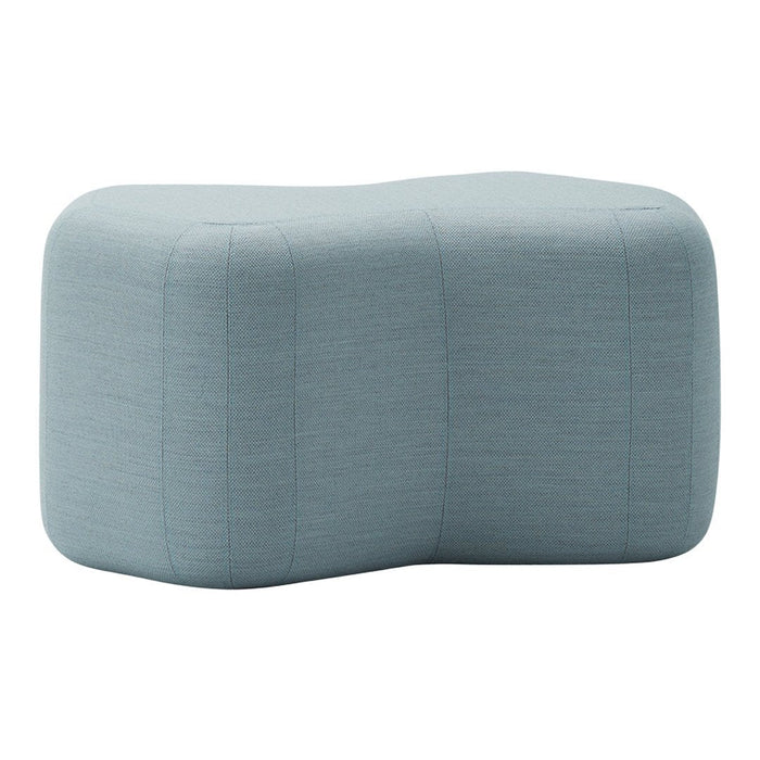 Textured light blue ottoman with a modern, organic shape and subtle horizontal stripes. Ideal for contemporary decor.