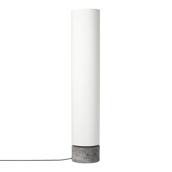 White cylindrical lamp with a textured concrete base, minimalist design for modern decor.