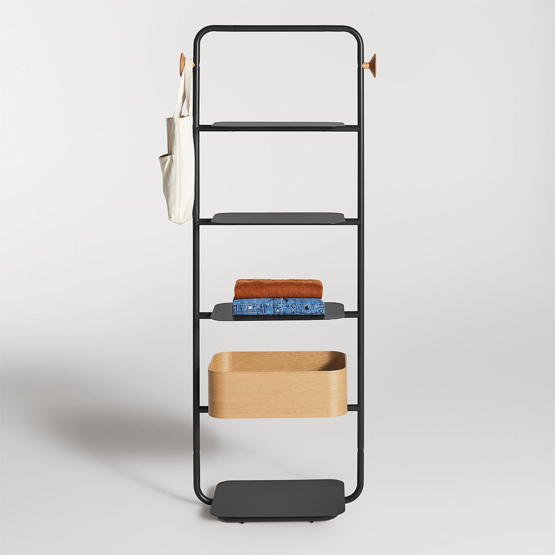 Black metal shelving unit with natural wood accents and a minimalist design, featuring patterned storage baskets.