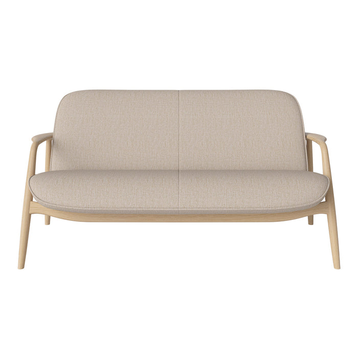 Beige upholstered sofa with a minimalist design and light wooden frame. Simple, modern fabric texture.