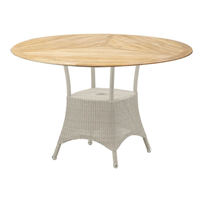 Round outdoor table with a natural wood top and light gray woven base, perfect for stylish patio setups.