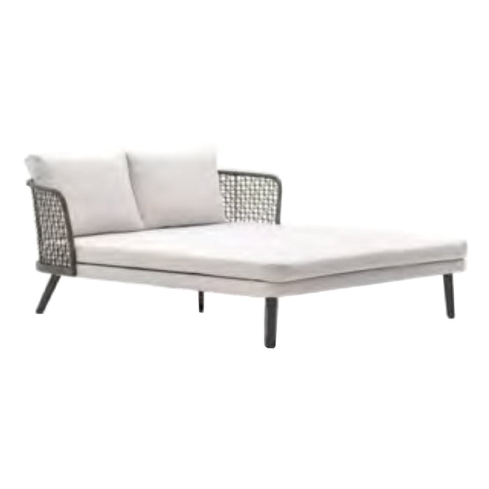Light grey lounge chair with soft pillows and a black woven backrest on slender legs, perfect for modern outdoor decor.