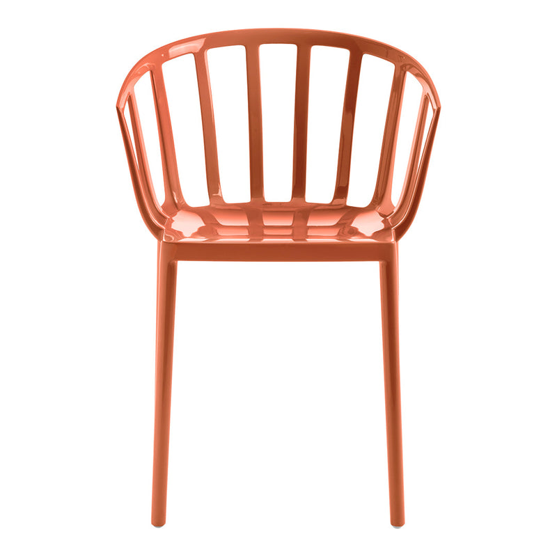Coral-colored chair with a slatted design, featuring sleek lines and a modern aesthetic for stylish decor.