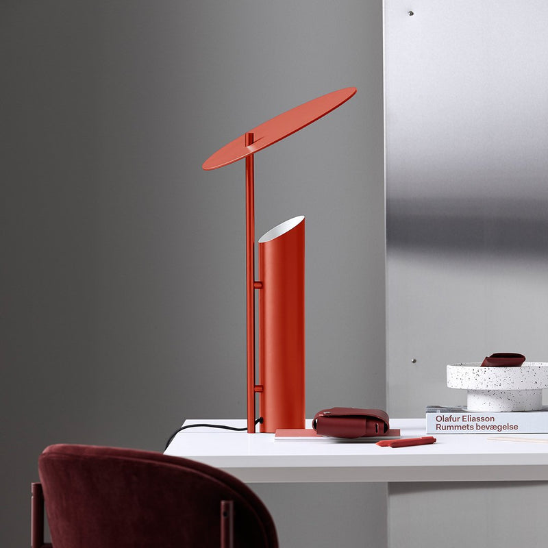 Modern desk lamp with a vibrant red finish and sleek, minimalistic design. Ideal for contemporary decor.