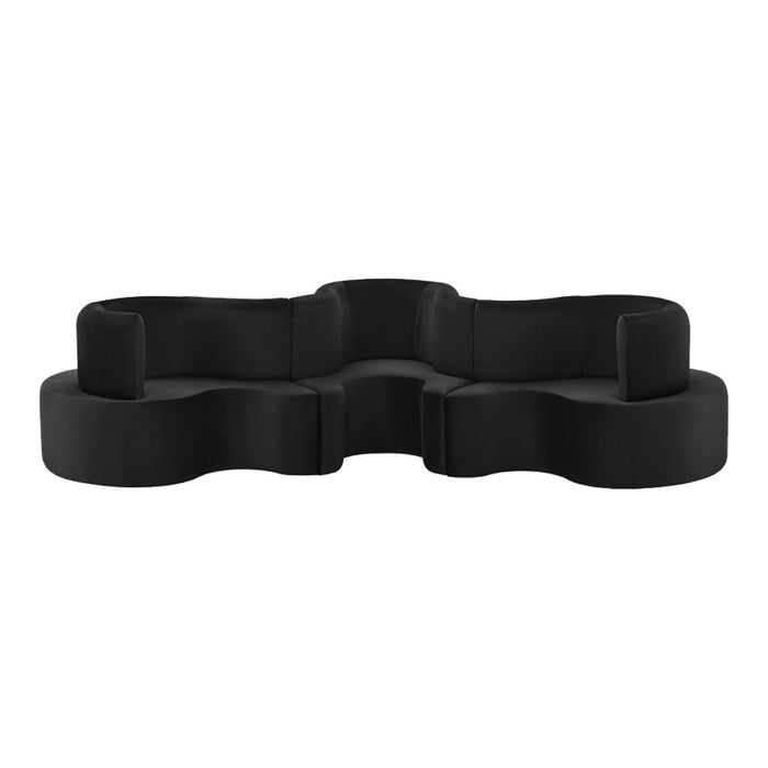 Black organic-shaped sectional sofa with smooth texture and modern design. Perfect for contemporary interiors.
