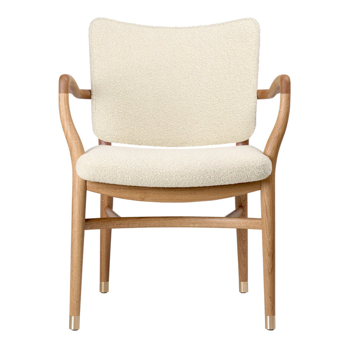 Light beige upholstered chair with smooth wood accents and elegant, minimalist design. Perfect for any modern space.
