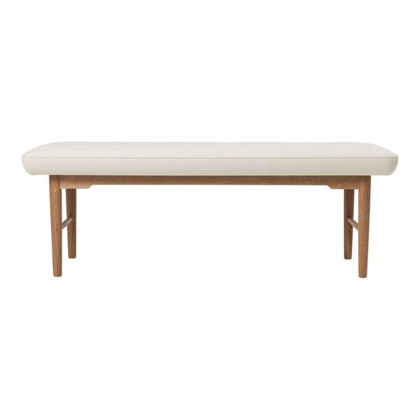 Light beige upholstered bench with a smooth surface and natural wood legs, featuring a simple modern design.