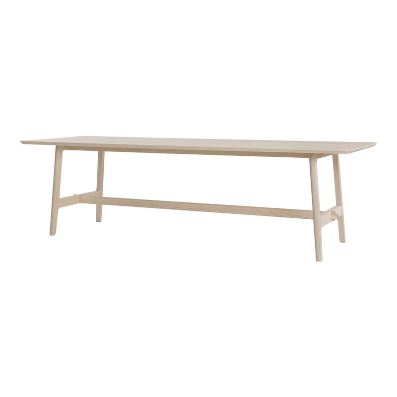 Light wood dining table with a sleek, minimalist design and natural finish, perfect for modern interiors.