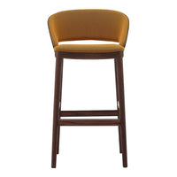 Yellow upholstered bar stool with a simple, modern design and dark wood legs. Smooth, curved backrest pattern.