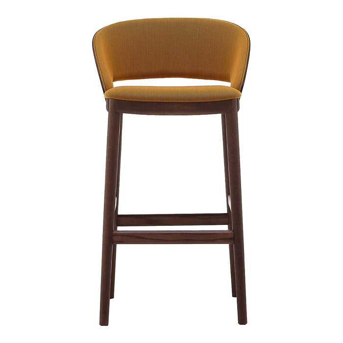 Yellow upholstered bar stool with a simple, modern design and dark wood legs. Smooth, curved backrest pattern.