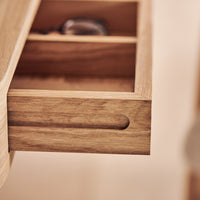 Light oak drawer with a smooth finish and natural wood grain pattern. Elegant and minimalist design.