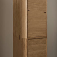 Wooden cabinet featuring a smooth, natural finish with a warm, light brown color. Minimalist design and clean lines.