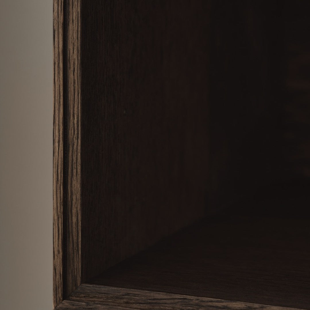 Dark wooden shelf interior with textured grain and smooth edges, featuring deep brown and subtle warm tones.