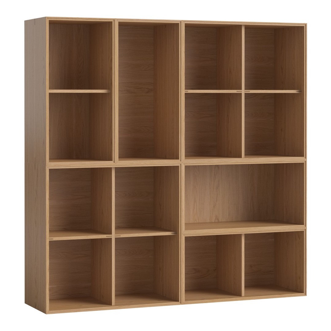 Light oak bookshelf with a simple, modern design featuring multiple open cubbies for versatile storage.