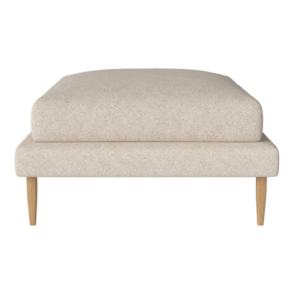 Light beige upholstered ottoman with a smooth texture and minimalistic design, featuring natural wood legs.