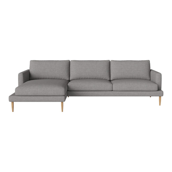 Modern gray sectional sofa with smooth fabric and clean lines, featuring light wood legs for a contemporary look.