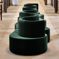 Dark green velvet seating with a spiral pattern, creating a modern and stylish look for any space.