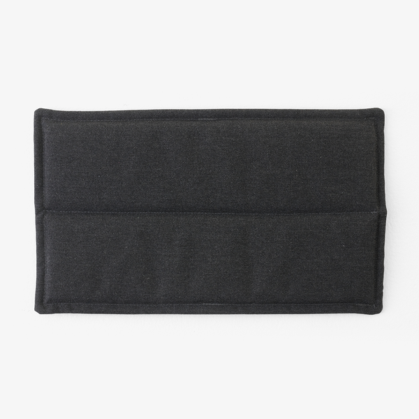 Black textured fabric with a smooth finish and subtle stitching detail, featuring a minimalist design.