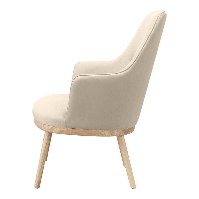 Cream upholstered chair with smooth fabric and light wooden legs, showcasing a minimalist design.
