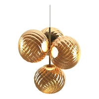 Sleek amber glass pendant light with intricate swirling patterns, perfect for modern decor.