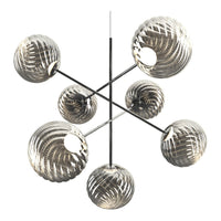 Modern chandelier featuring chrome accents and glass globes with a rippled pattern in clear and smoky hues.