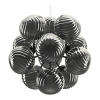 Glossy black globes with swirling patterns, arranged in a modern chandelier design. Ideal for contemporary decor.