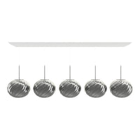 Shiny silver pendant lamps with a spiral pattern, hanging from a sleek white ceiling mount.
