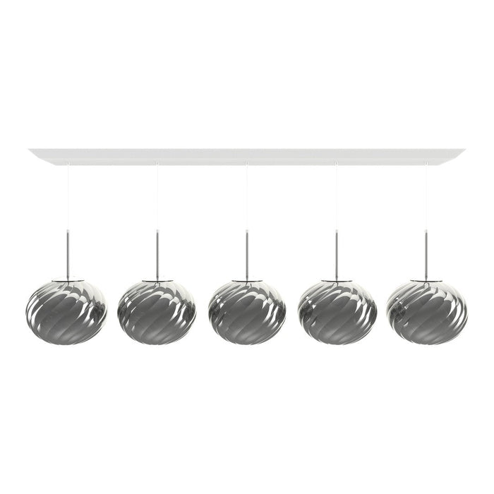 Shiny silver pendant lamps with a spiral pattern, hanging from a sleek white ceiling mount.