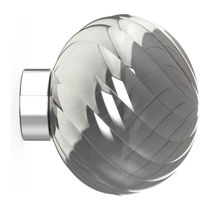 Clear glass knob with swirling patterns and a polished chrome base, adding elegance to any decor.