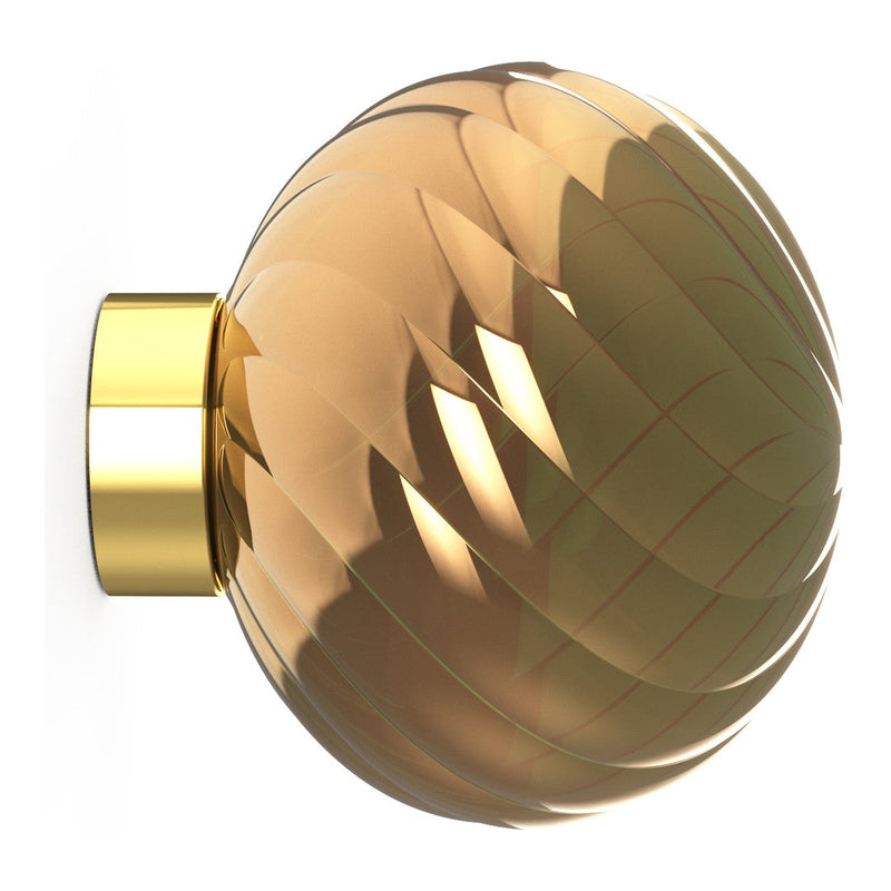 Amber glass orb with a diamond pattern and gold accent, perfect for modern decor.