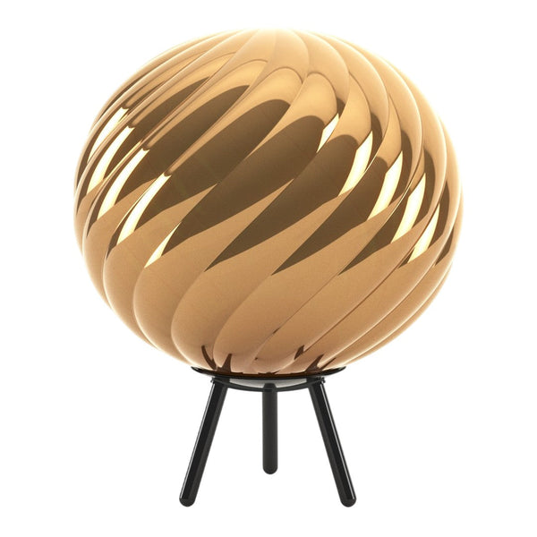 Gold spiral decorative lamp on a black stand, featuring a glossy finish and a modern design. Perfect for stylish interiors.