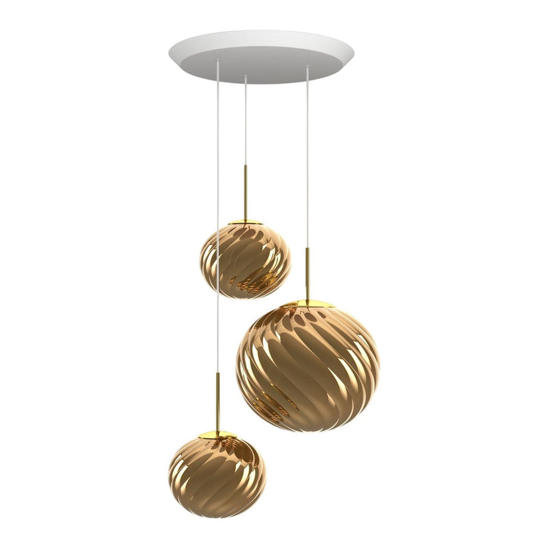 Gold and shiny pendant lights with a wavy pattern, suspended from a white ceiling mount.