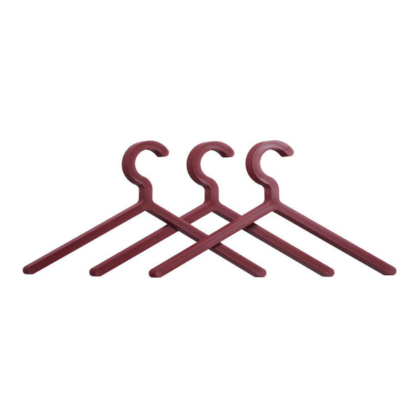 Set of three deep burgundy hangers with a smooth matte finish and minimalist design. Perfect for stylish storage.