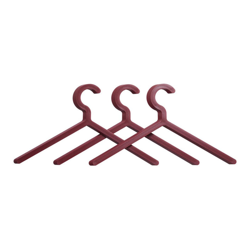 Set of three deep burgundy hangers with a smooth matte finish and minimalist design. Perfect for stylish storage.